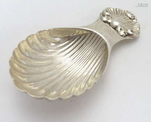 A silver caddy spoon with shell formed bowl. hallmarked Birmingham 1966 maker S J Rose & Son. Approx