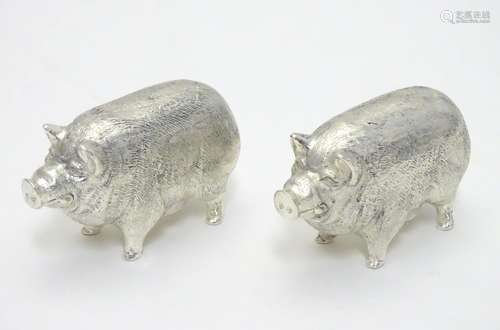 A 21stC novelty silver plated salt and pepper cruet formed as pigs. Approx 2 1/2