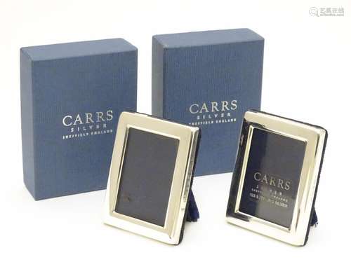 A pair of miniature photo frames of rectangular form hallmarked Sheffield 2003 maker Carrs. Each 2