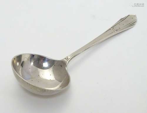 An Art Deco silver preserve spoon hallmarked Sheffield 1922 maker Joseph Elliot & Sons. 4 1/4'' long