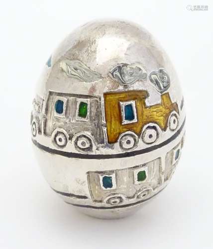 A silver plate and enamel novelty egg with enamel train design, Italian collectable, signed under