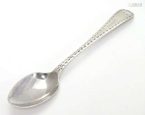 A silver old English pattern tea spoon with bright cut decoration. London 1787 maker Hester Bateman.