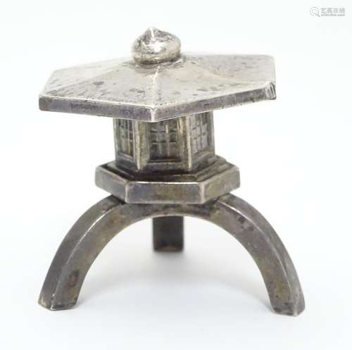 An unusual novelty pepper formed as a Japanese pagoda style building. Marked under Sterling 2