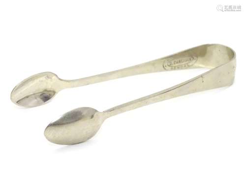 Silver plate sugar tongs bearing retailers stamp ' Watchmaker D. Carlisle, Kendal. Approx 4 1/4