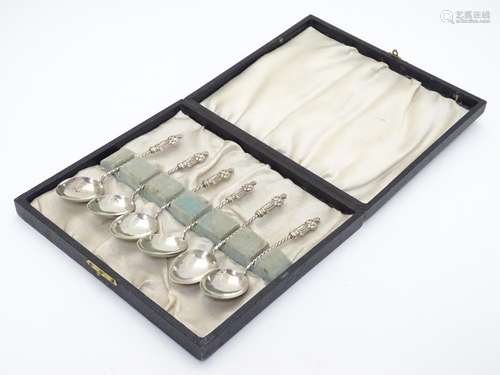 A cased set of 6 silver apostle spoons with barley twist stems. Hallmarked Birmingham 1900, maker