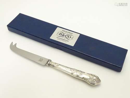 A silver handled King?s Pattern cheese knife. Hallmarked Birmingham 1993 maker WI Broadway & Co.