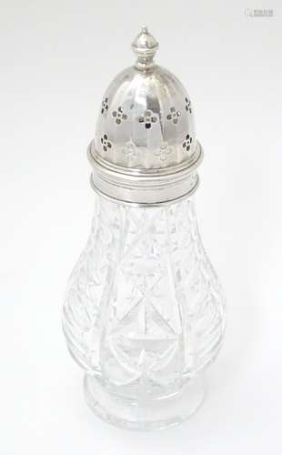 A cut glass sugar caster / muffineer marked Edinburgh crystal, with silver mounts and top,