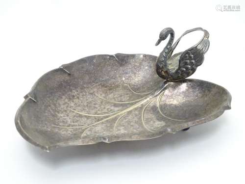 A Spanish silver plate dish of stylised leaf form with swan formed handle. Approx. 10