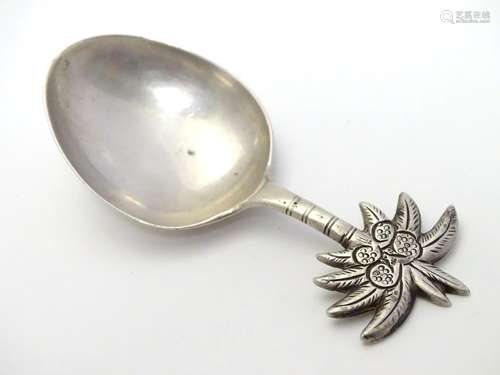 A novelty silver caddy spoon the handle decorated with palm tree and coconuts , marked Stg.Sil. 3