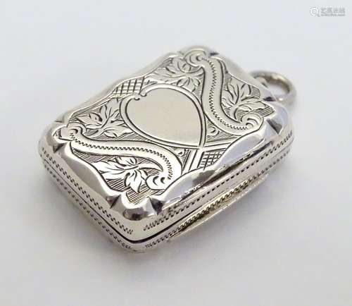 A Victorian silver vinaigrette with engraved decoration and gilded interior. Hallmarked Birmingham