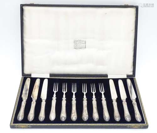 A cased set of silver handled fruit knives and forks, hallmarked Sheffield 1926, maker JS. (6+6)