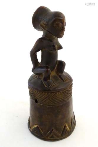 Ethnographic / Native / Tribal: A carved African wooden bell / vessel with geometric detail