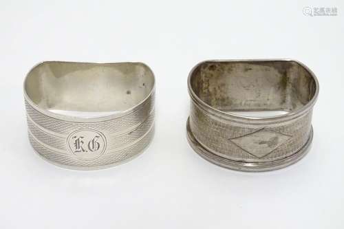 Two Art Deco silver D shaped napkin rings with engine turned decoration. Hallmarked Birmingham