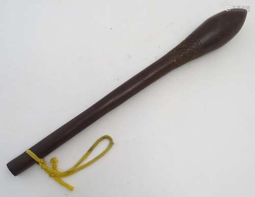 Ethnographic / Native / Tribal: A hardwood tribal club with a pointed, ovoid head and carved