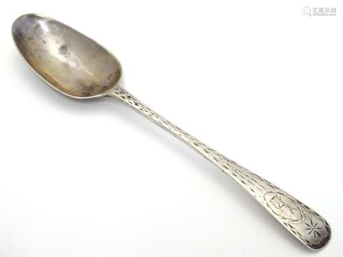 A Georgian Irish silver dessert/christening spoon with edge decoration bearing crest of a stag