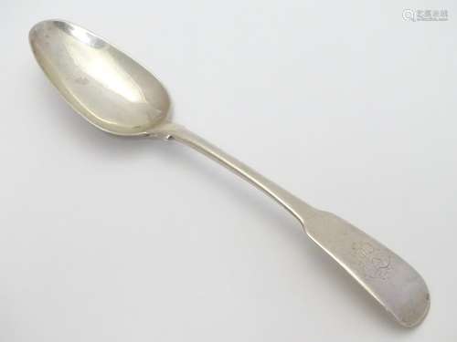 A Georgian Irish silver fiddle pattern dessert spoon with rat tail bowl. Hallmarked Dublin 1807