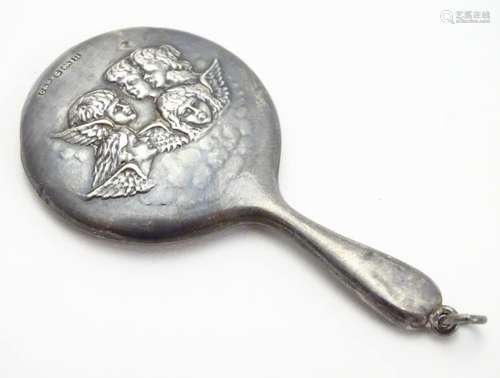 A miniature hand mirror with embossed angel decoration. Hallmarked Birmingham 1912 maker