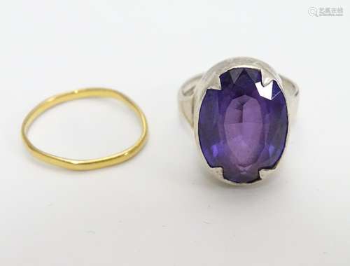 A hallmarked silver ring set with facet cut amethyst. Ring size approx O together with a gold