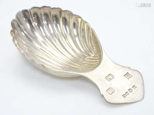 A silver caddy spoon with shell formed bowl hallmarked Birmingham 1979 maker A Marston & Co. 3 1/