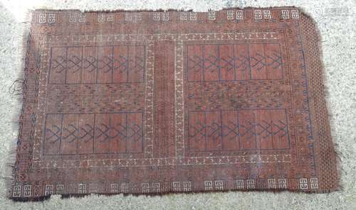 Caret / rug : A hand made red ground rug with blue white and brown detail. Approx 81