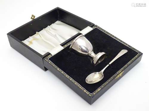 A silver christening set comprising egg cup and spoon in fitted case. Hallmarked Birmingham 1968/