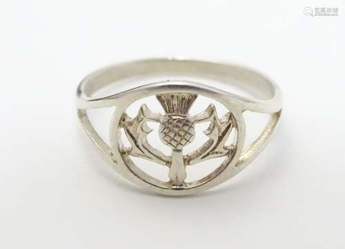 A silver signet ring with Scottish thistle decoration. Ring size approx L Please Note - we do not