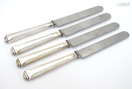 A set of four art deco silver handled tea knives. Hallmarked Sheffield 1948 maker Barker brothers