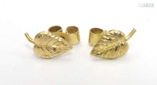 A Pair of 9ct gold stud earrings formed as leaves. Approx 3/8