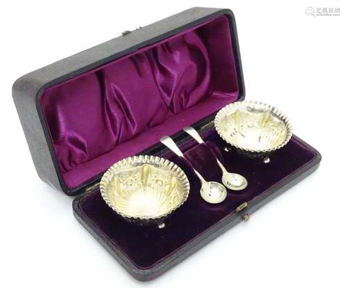 A cased pair of Victorian silver table salts hallmarked Birmingham 1895 maker J.G with associated