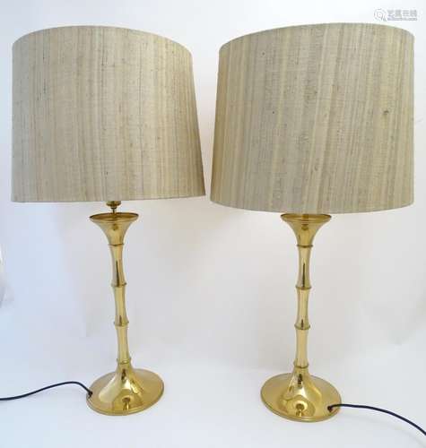 A pair of 20thC brass table lamps, of sectional vegetal form. 33 1/2