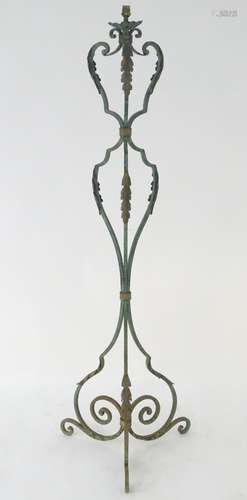 A late 19th / early 20thC wrought iron standard lamp with a verdisgris finish and gilt foliate