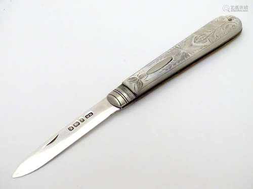 A silver folding fruit knife with engraved mother of peal handle. Hallmarked Sheffield 1897 maker