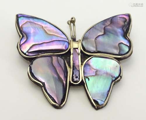 A vintage Mexican brooch formed as a butterfly with paua / abalone shell detail. A 3/4