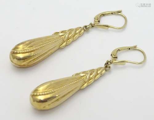 A pair of 14ct gold earrings set with ornate drops Approx 1 3/4