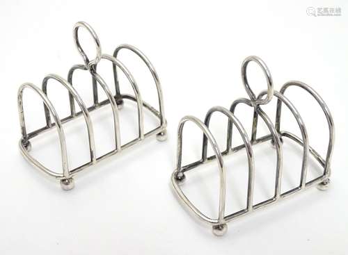 Two silver4-bar toast racks hallmarked Chester 1909 / 1911 maker Haseler Brothers (Edward John