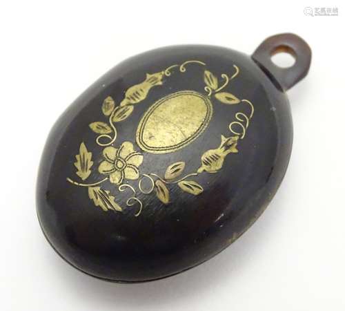 A Victorian faux tortoiseshell pendant locket with inlaid pique work detail. Hinging open to