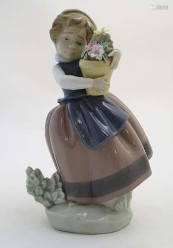 A Lladro figure of a girl with a flower pot, Spring is Here, model no. 5223. Approx. 7