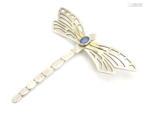 A silver pendant formed as a dragonfly set with opalescent cabochon to centre. 2 1/2