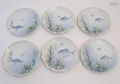 Six Rosenthal side plates with lobed gilt rims, with fish, shell and seaweed decoration. Marked