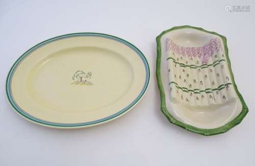 An Art Deco Royal Doulton oval serving dish in the pattern Congress, with central stylised tree