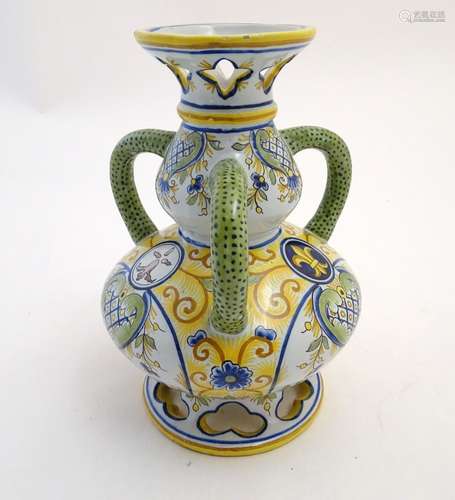 A Continental faience double gourd vase with three loop handles, reticulated openwork to rim and