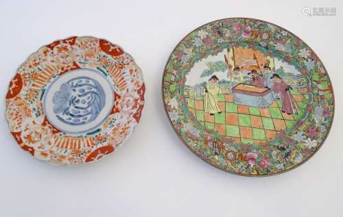 Two oriental plates, one decorated with flowers, foliage and stylised birds. The other with a