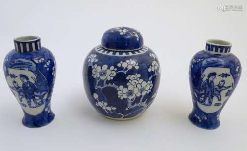 A Chinese blue and white ginger jar decorated with cherry blossom, together with a pair of small