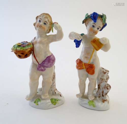 Two Italian putti / cherub figures depicting the seasons Spring and Summer, one with a basket of