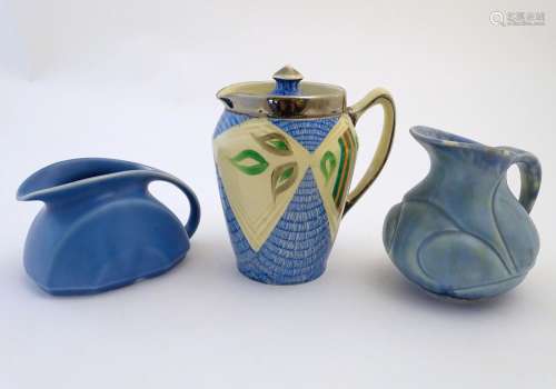 Three assorted English studio pottery jugs, one with a lid, hand painted decoration and lustre