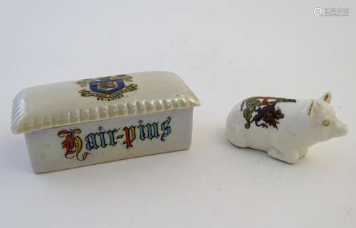 Two pieces of crested ware, to include a Carlton China lidded hair pin box, the top decorated with