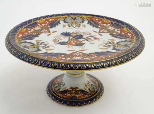 An Ashworth Bros tazza in the Imari palette with floral decoration with gilt highlights. Marked