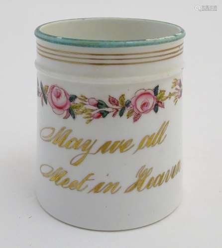 A Victorian porcelain mug bearing the motto 'May we all Meet in Heaven' in gilt lettering with a