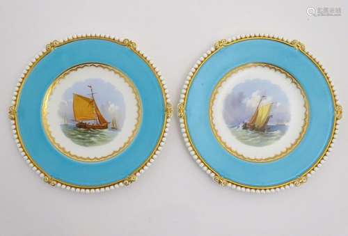 A pair of Copeland style marine dessert plates with depictions of boats at sea to the central