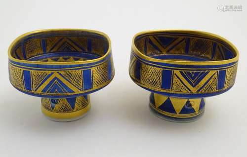 A matched pair of studio pottery footed squared bowls / pots with cobalt blue and gilt geometric